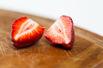 Image showing close up of ripe red strawberries on cutting board