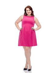 Image showing happy young plus size woman posing in pink dress