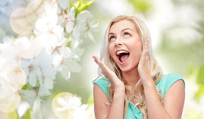 Image showing surprised smiling young woman or teenage girl