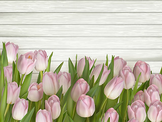Image showing Tulips on wooden background. EPS 10