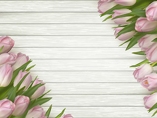 Image showing Pink tulips on wooden background. EPS 10