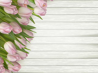 Image showing Pink flowers tulips on the light wooden. EPS 10