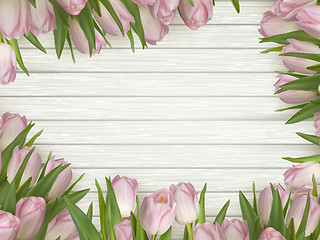 Image showing Pink tulips on a wooden background. EPS 10
