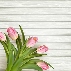 Image showing Pink tulips over white wood. EPS 10 