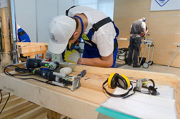 Image showing Young carpenter performs task of competition