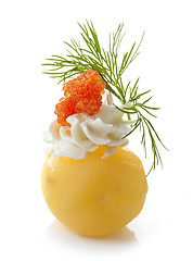 Image showing boiled potato decorated with cream cheese, red caviar and dill