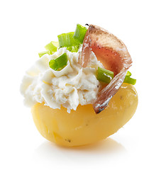 Image showing boiled potato decorated with cream cheese, anchovy and spring on