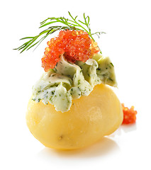 Image showing boiled poato decorated with green butter and red caviar