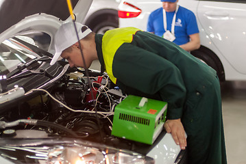 Image showing Young car mechanic passes competition stage.Tyumen