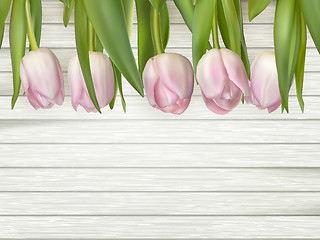 Image showing Pink flowers tulips on the light wooden. EPS 10