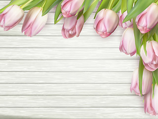 Image showing Pink tulips on wooden background. EPS 10