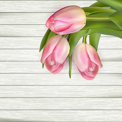 Image showing Pink tulips on wooden background. EPS 10