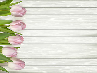 Image showing Tulips on wooden background. EPS 10