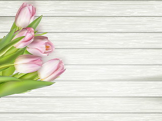 Image showing Beautiful pink tulips on wooden background. EPS 10 