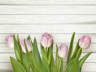 Image showing Pink tulips over white wood table. EPS 10