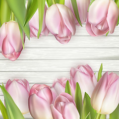 Image showing Beautiful pink tulips on wooden background. EPS 10