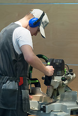 Image showing Young carpenter performs task of competition