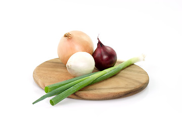 Image showing Onions on a wooden board