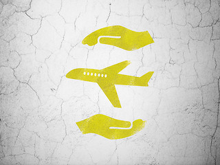 Image showing Insurance concept: Airplane And Palm on wall background