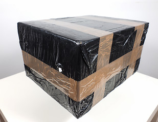 Image showing Black packet parcel