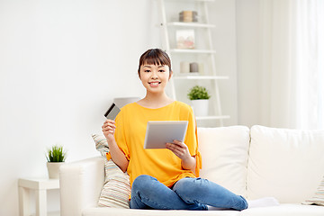 Image showing happy asian woman with tablet pc and credit card