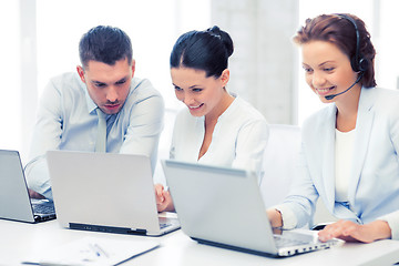 Image showing group of people working with laptops in office