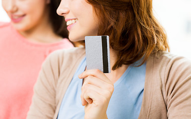 Image showing close up of women or friends with credit card