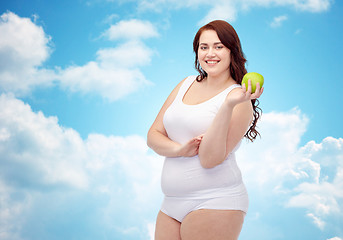 Image showing happy plus size woman in underwear with apple