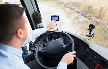 Image showing close up of bus driver driving with gps navigator