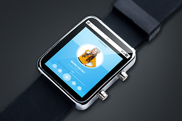 Image showing close up of smart watch with music player track