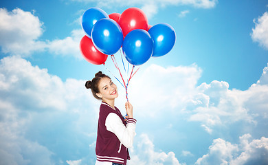 Image showing happy teenage girl with helium balloons