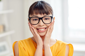 Image showing happy asian young woman in glasses at home