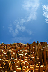 Image showing Low angle view of stacked wooden boards