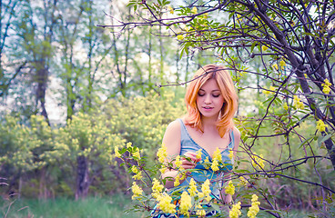 Image showing Young woman in the spring garden