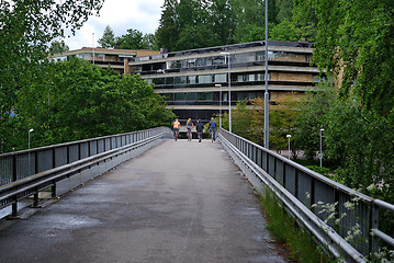 Image showing Bicyclists on the bridge.