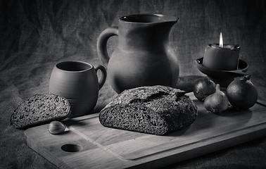 Image showing Still life with homemade bread and pottery, black and white phot