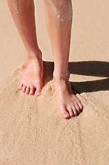 Image showing Feet on sandy beach