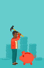 Image showing Man breaking piggy bank.