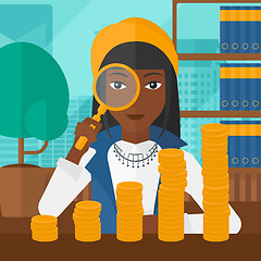 Image showing Woman with magnifier and golden coins. 