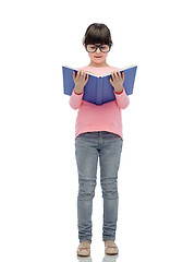 Image showing happy little girl in eyeglasses reading book