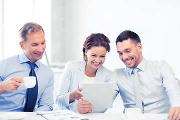 Image showing business team having fun with tablet pc in office