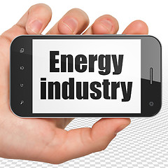 Image showing Industry concept: Hand Holding Smartphone with Energy Industry on display