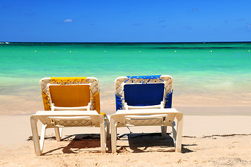 Image showing Chairs on sandy beach