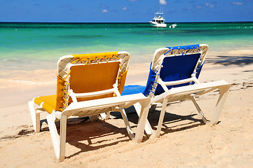 Image showing Chairs on sandy tropical beach