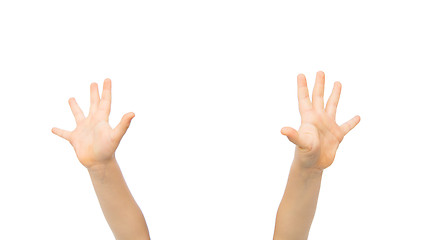 Image showing close up of little child hands raised upwards