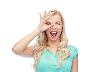 Image showing young woman making ok hand gesture