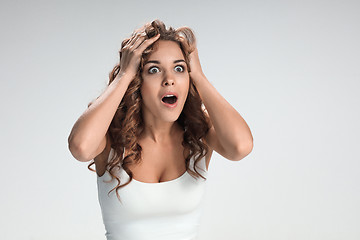 Image showing Portrait of young woman with shocked facial expression