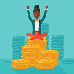 Image showing  Happy business woman sitting on coins.