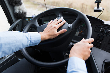 Image showing close up of driver driving passenger bus