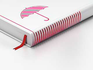 Image showing Safety concept: closed book, Umbrella on white background